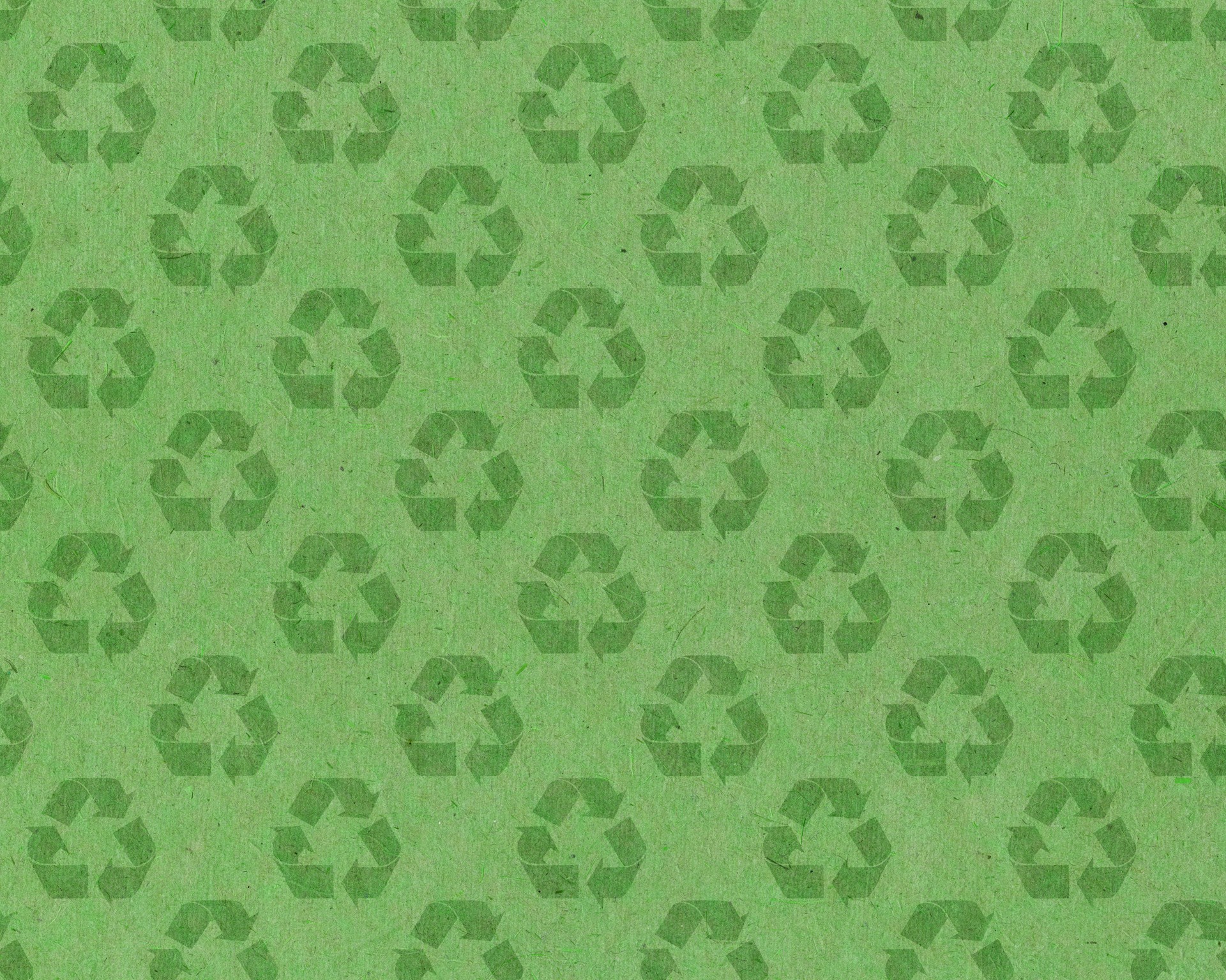 recycle symbol on green paper